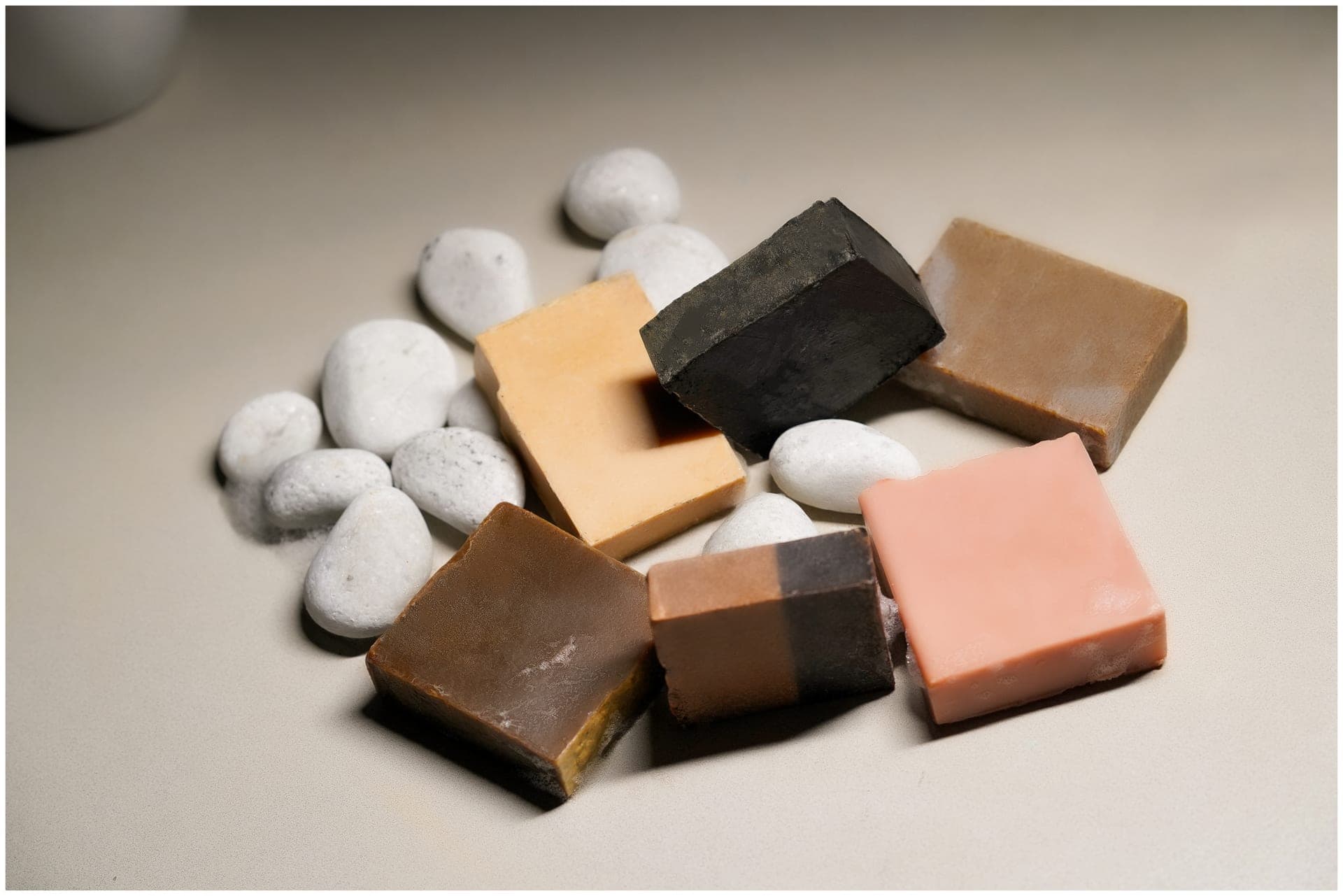The full Soapy Poetry soap collection on river pebbles
